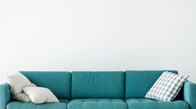 Comfortable couch with cushion isolated no people