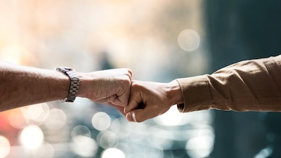 people bumping their fists