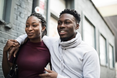 Happy couple walking around in the city