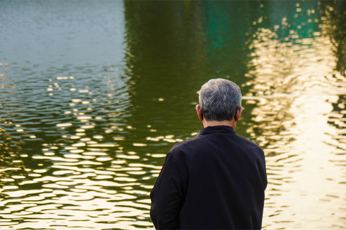 Man looking at water