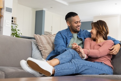 A couple sitting together discussing their relationship connection spectrum and emotional expectations.
